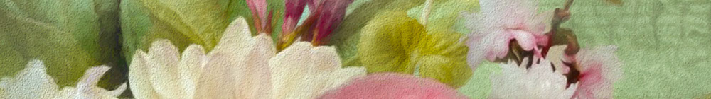 close-up photo of a paintbrush mixing paint on a wooden palette