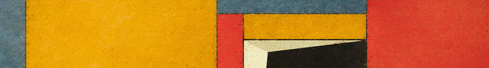 close-up photo of a paintbrush mixing paint on a wooden palette