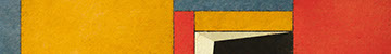 close-up photo of a paintbrush mixing paint on a wooden palette