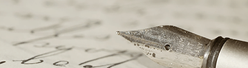 close-up photo of an ink pen on a sheet of handwriting