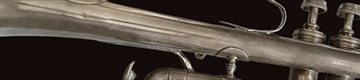 close-up photo of a flugelhorn on a dark background