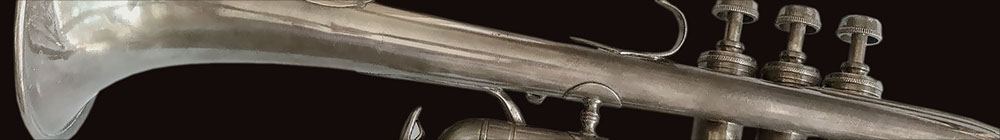 close-up photo of a flugelhorn with dark background