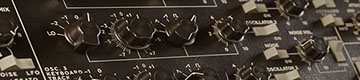 close-up photo of a violin on a dark background