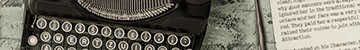 overhead photo of a vintage typewriter with sheet of typed paper on an old table top